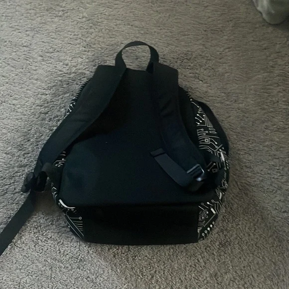 a black designed back pack - Picture 2 of 4